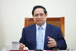 Prime Minister Pham Minh Chinh holds phone talks with the Prime Minister and Minister of Foreign Affairs of the State of Qatar, Sheikh Mohammed bin Abdulrahman bin Jassim Al-Thani. (Photo: VNA)