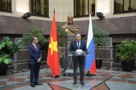 Russian Minister of Foreign Affairs Sergei Lavrov (R) speaks at the opening of the exhibition marking the 75th founding anniversary of diplomatic ties between Vietnam and Russia in Moscow on February 11. (Photo: VNA)