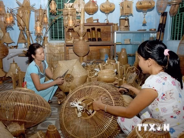 Photos of Vietnamese traditional trade villages displayed in Mozambique ảnh 1