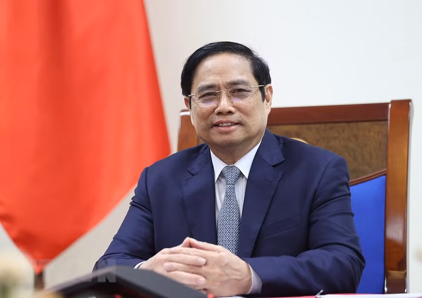 PM holds phone talks with US Presidential Envoy for Climate ảnh 1