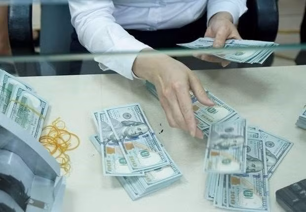 Reference exchange rate down 1 VND on March 10 ảnh 1