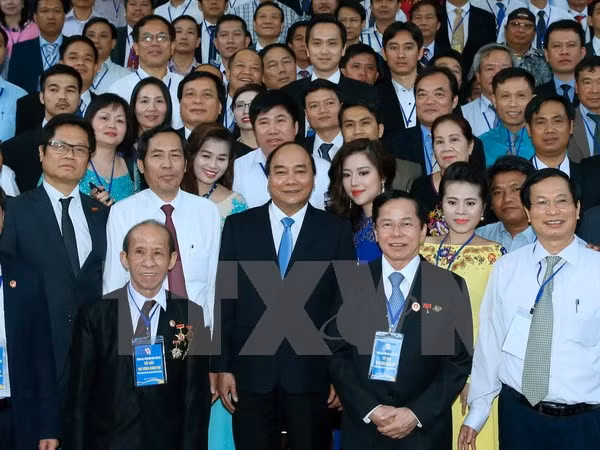 PM asks press to accompany businesses in economic integration ảnh 1 PM asks press to accompany businesses in economic integration ảnh 1