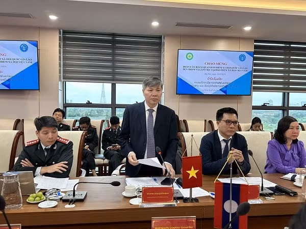 Vietnam, Laos to enhance social security cooperation ảnh 1