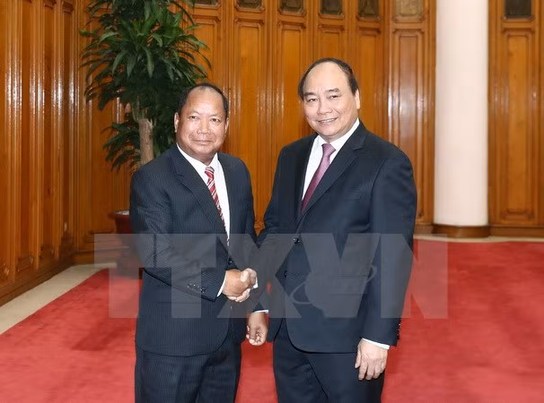 PM calls for stronger security ties with Laos ảnh 1