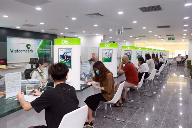Reference exchange rate revised down by 4 VND ảnh 1