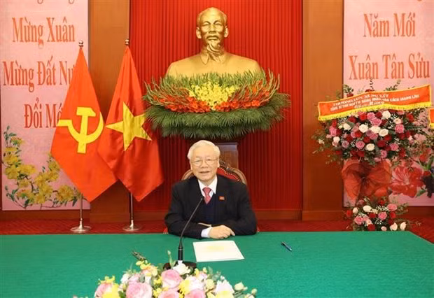 Vietnamese, Lao Party chiefs hold phone talks ảnh 1