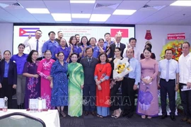 Participants of the get-together in a group photo (Source: VNA)