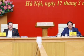 Chairman of National Assembly Tran Thanh Man (left) and Prime Minister Pham Minh Chinh co-chair the event in Hanoi on March 17. (Photo: VNA)