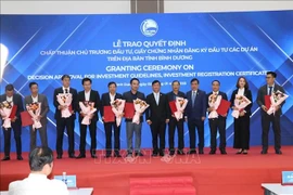 Investors are awarded investment certificates by Binh Duong province's authorities at the January 2 ceremony. (Photo: VNA)