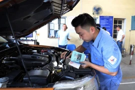 An car is inspected at a vehicle inspection centre in Hanoi. (Photo: VNA) 