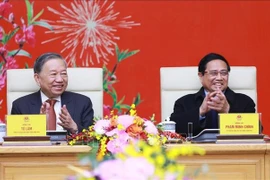 Party General Secretary To Lam (left) and Prime Minister Pham Minh Chinh at the gathering on February 3. (Photo: VNA)