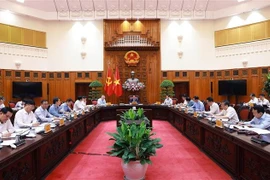At the exclusive meeting to seek solutions to the US's new tariff policy, chaired by PM Pham Minh Chinh in Hanoi on May 6. (Photo: VNA)