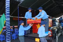 At a ceremony held in Binh Phuoc province on January 10 to receive the remains of 41 martyrs who fell down during wartime in Cambodia. (Photo: VNA)