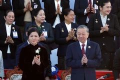 Party chief attends 50th anniversary of Laos National Day