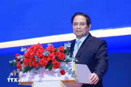 Prime Minister Pham Minh Chinh speaks at the conference in HCM City on August 2 on the implementation of the National Assembly’s Resolution No. 222/2025/QH15 on the IFC. (Photo: VNA)