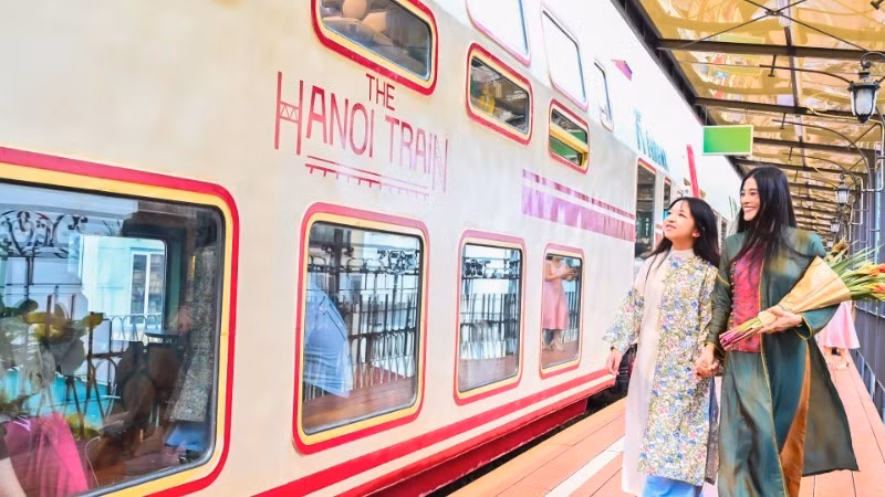 Tourists ride the “Five Gates” train, a new tourism product in Hanoi. (Photo: nhandan.vn)