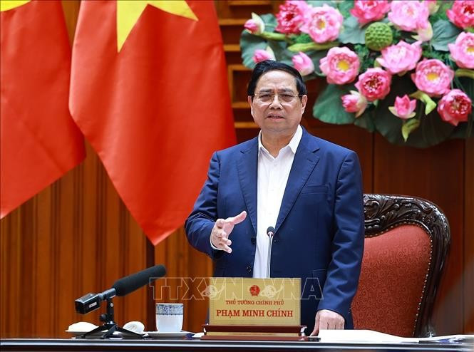 Prime Minister Pham Minh Chinh speaks at the meeting of permanent Government members in Hanoi on December 23. (Photo: VNA)