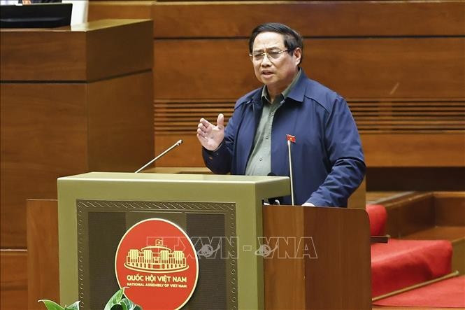 Prime Minister Pham Minh Chinh speaks at the NA discussion on October 30. (Photo: VNA)