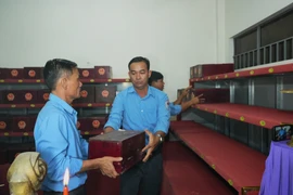 The remains are placed at the martyrs’ remains storage house at Hill 82 Martyrs’ Cemetery in Tan Bien commune, Tay Ninh province, before the re-burial ceremony. (Photo:VNA)
