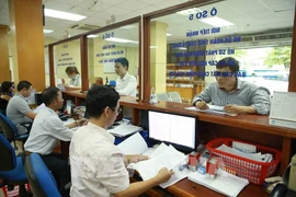 Activities at the Hanoi Department of Taxation (Photo: VNA)