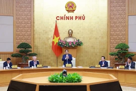 PM Pham Minh Chinh chairs the Government’s regular meeting on December 6. (Photo: VNA)
