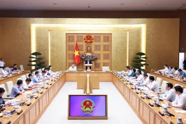 Prime Minister Pham Minh Chinh addresses a conference reviewing one month of running the two-tier local administration system on July 28. (Photo: VNA)