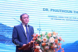 An official from the Lao Ministry of Finance addresses the workshop in Vientiane on April 24. (Photo: VNA)