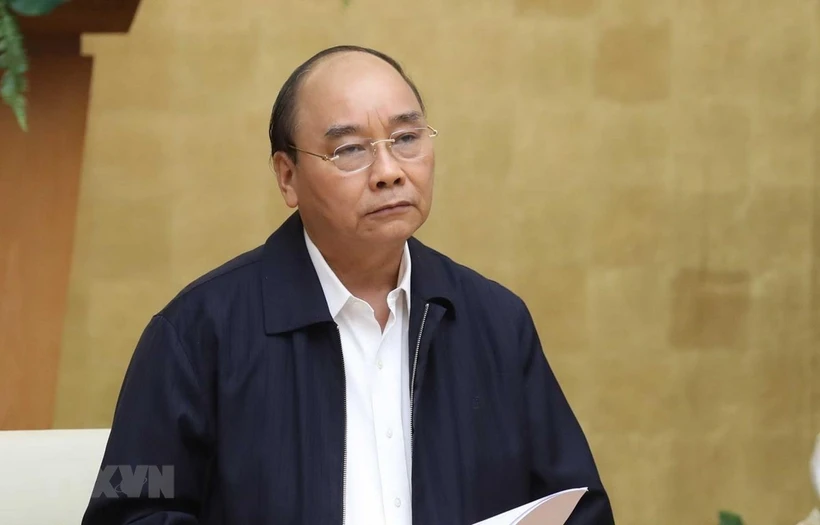 Prime Minister Nguyen Xuan Phuc chairs a meeting between the Government’s permanent members and the National Steering Committee for COVID-19 Prevention and Control (Photo: VNA)