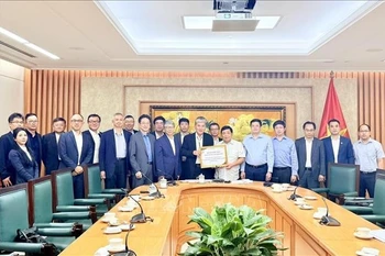 Delegates at the working session (Photo: VNA)