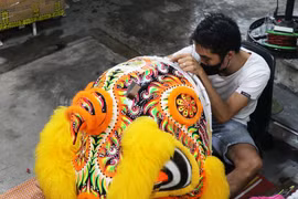Lion head crafting for the Mid-Autumn Festival market in Hue