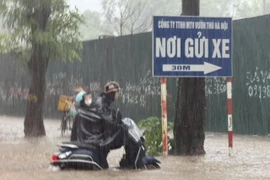 Torrential rain floods Hanoi
