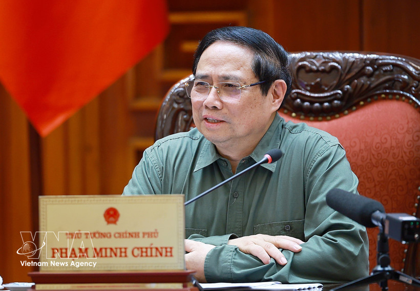 Prime Minister Pham Minh Chinh speaks at the meeting between standing Government members and representatives of ministries, agencies and Phu Tho province (Photo: VNA)
