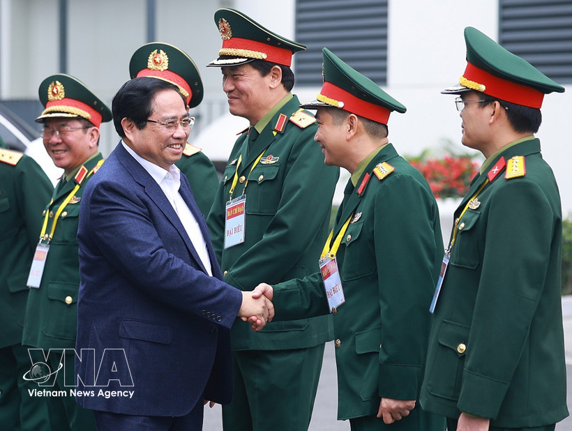 Prime Minister Pham Minh Chinh meets with leaders of the Viettel Military Industry and Telecoms Group. (Photo: VNA)