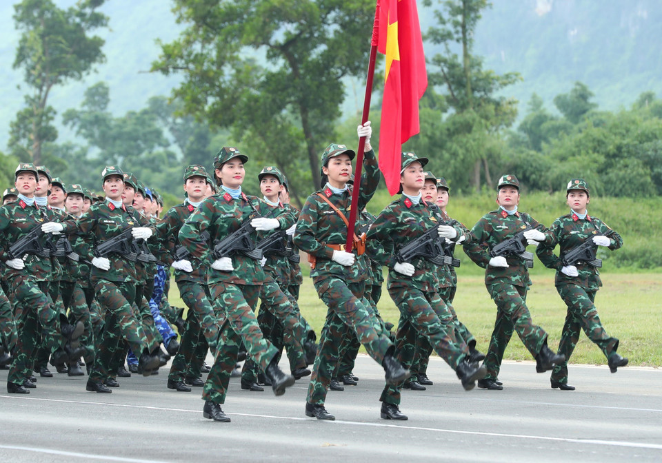 Female officers from various forces join the rehearsal. (Photo: VNA)
