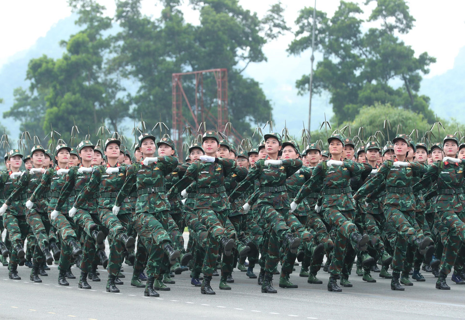 Female information personnel join the rehearsal. (Photo: VNA)