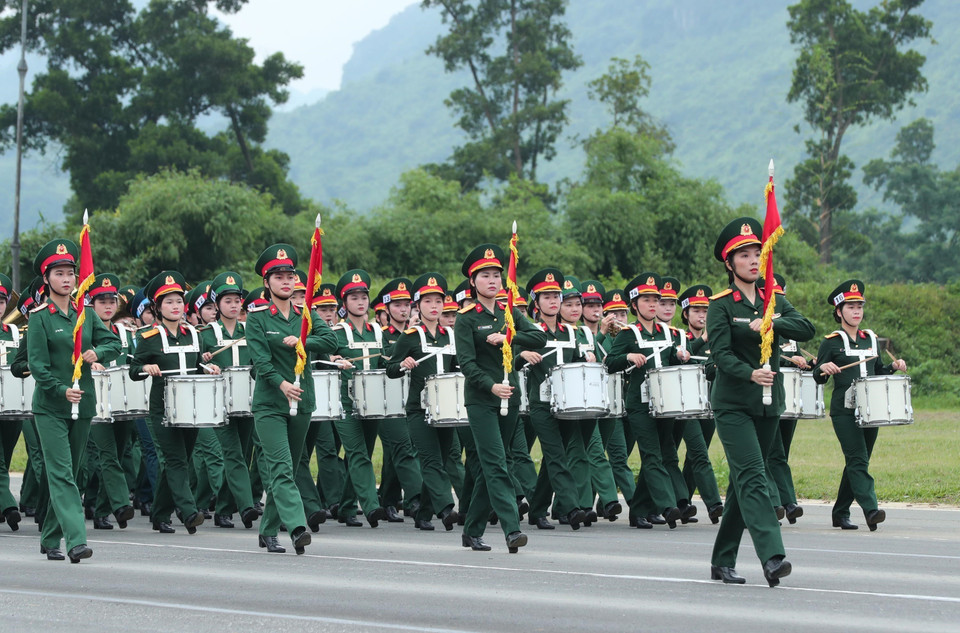 Female military band participates in the rehearsal. (Photo: VNA)