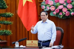 Prime Minister Pham Minh Chinh speaks at the meeting (Photo: VNA)