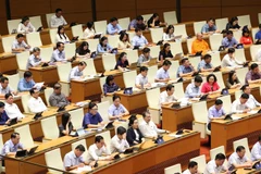 The NA’s fifth sitting day discusses three draft laws. (Photo: VNA)