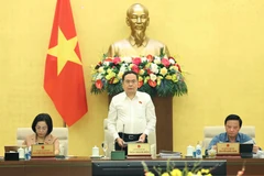 NA Chairman Tran Thanh Man (C) speaks at the 5th thematic session on law-building on August 12 (VNA)