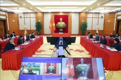 General Secretary of the CPV Central Committee To Lam talks over the phone with General Secretary of the LPRP Central Committee and President of Laos Thongloun Sisoulith on December 1. (Photo: VNA)