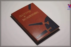 Young man keeping traditional craft of bookbinding alive