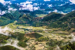 Fluffy white clouds over Khau Pha Pass