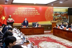 NA Chairman Tran Thanh Man has a working session with the Standing Board of the Hai Phong city Party Committee on December 18. (Photo: VNA)