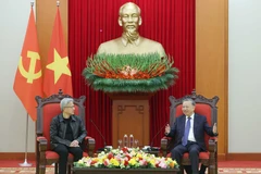 Party General Secretary To Lam (R) receives President and CEO of NVIDIA Jensen Huang in Hanoi on December 6. (Photo: VNA)