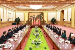 During his stay in China, PM Pham Minh Chinh meets with General Secretary of the Communist Party of China and President of China Xi Jinping in Beijing on June 26. (Photo: VNA)