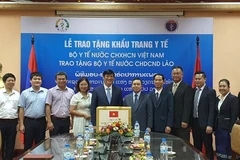Ministry of Health presents 200,000 face masks to Lao counterpart
