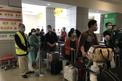 Nearly 310 Vietnamese citizens return home from Angola