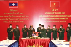 Vietnamese, Lao defence ministries ink cooperation plan for 2021