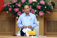 Permanent gov’t members discuss cooperation projects with Laos 