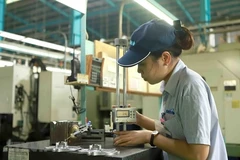 Manufacturing output returns to growth in June